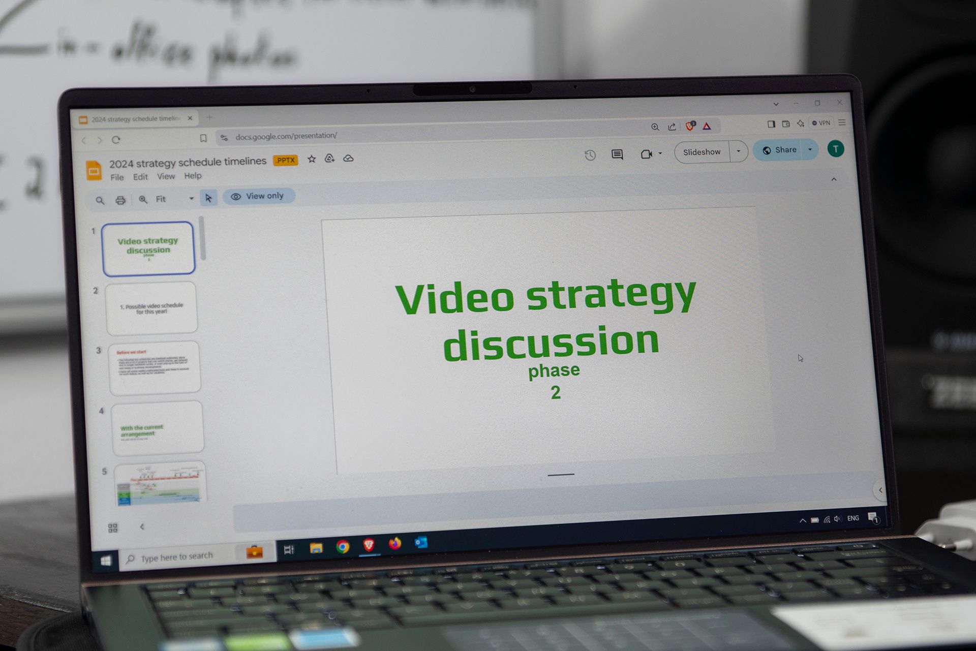 Laptop screen showing the 'Video strategy discussion phase 2' presentation slide